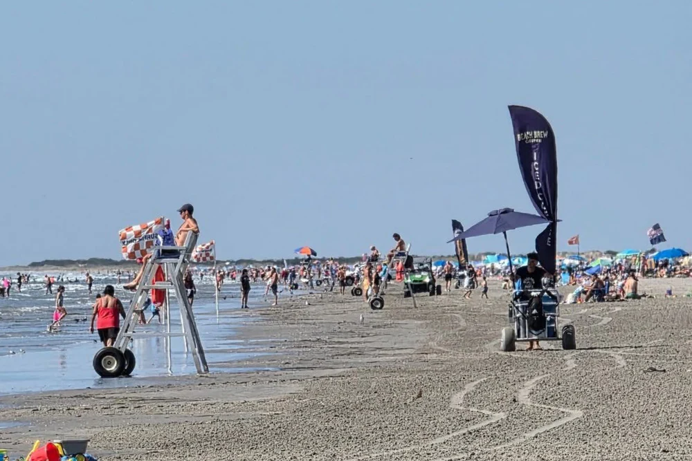 Beach Brew baristas walking coffee carts on the beach